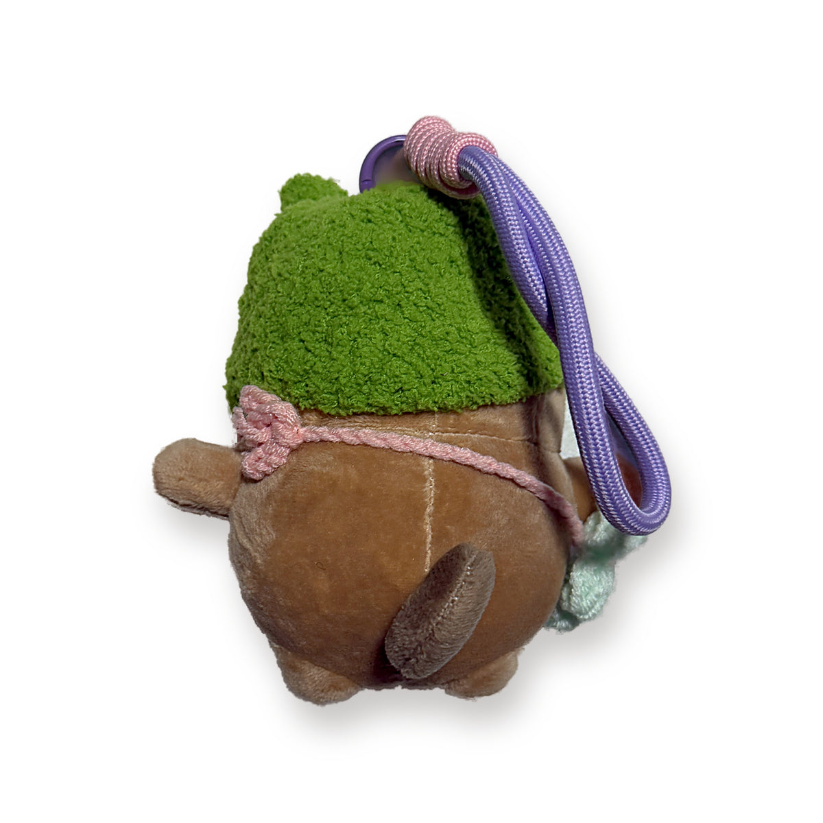 PUUG pug plush bag charm in a green crochet frog hat, back view with paracord strap