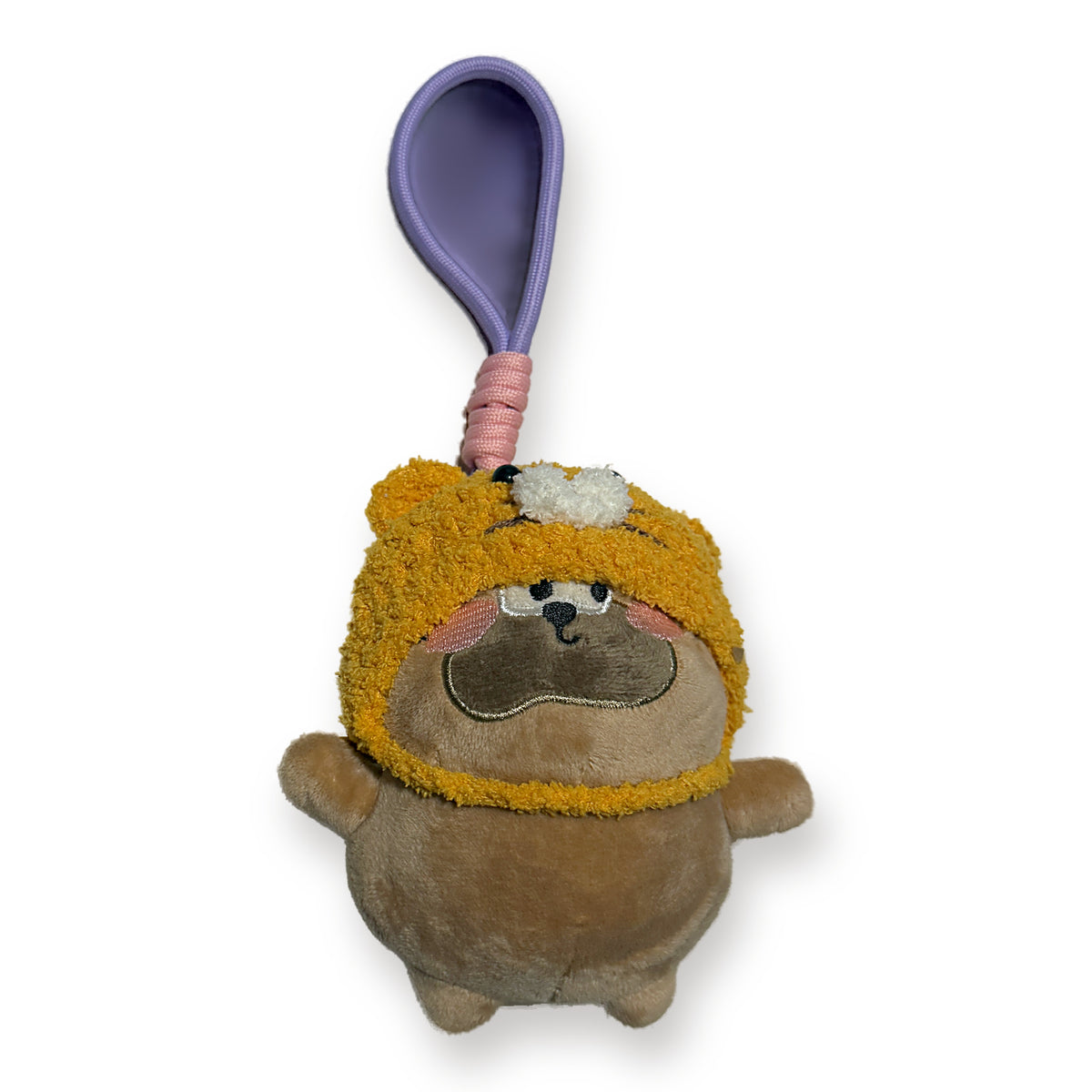 PUUG pug plush bag charm in a yellow crochet tiger hat, front view